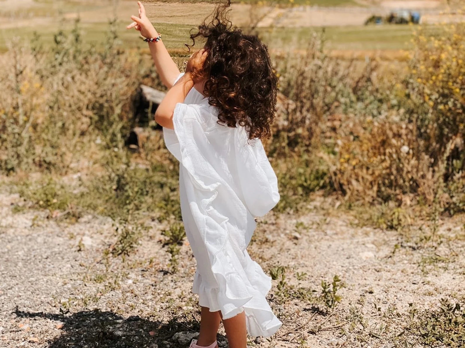 White Muslin Poncho With Ruffles