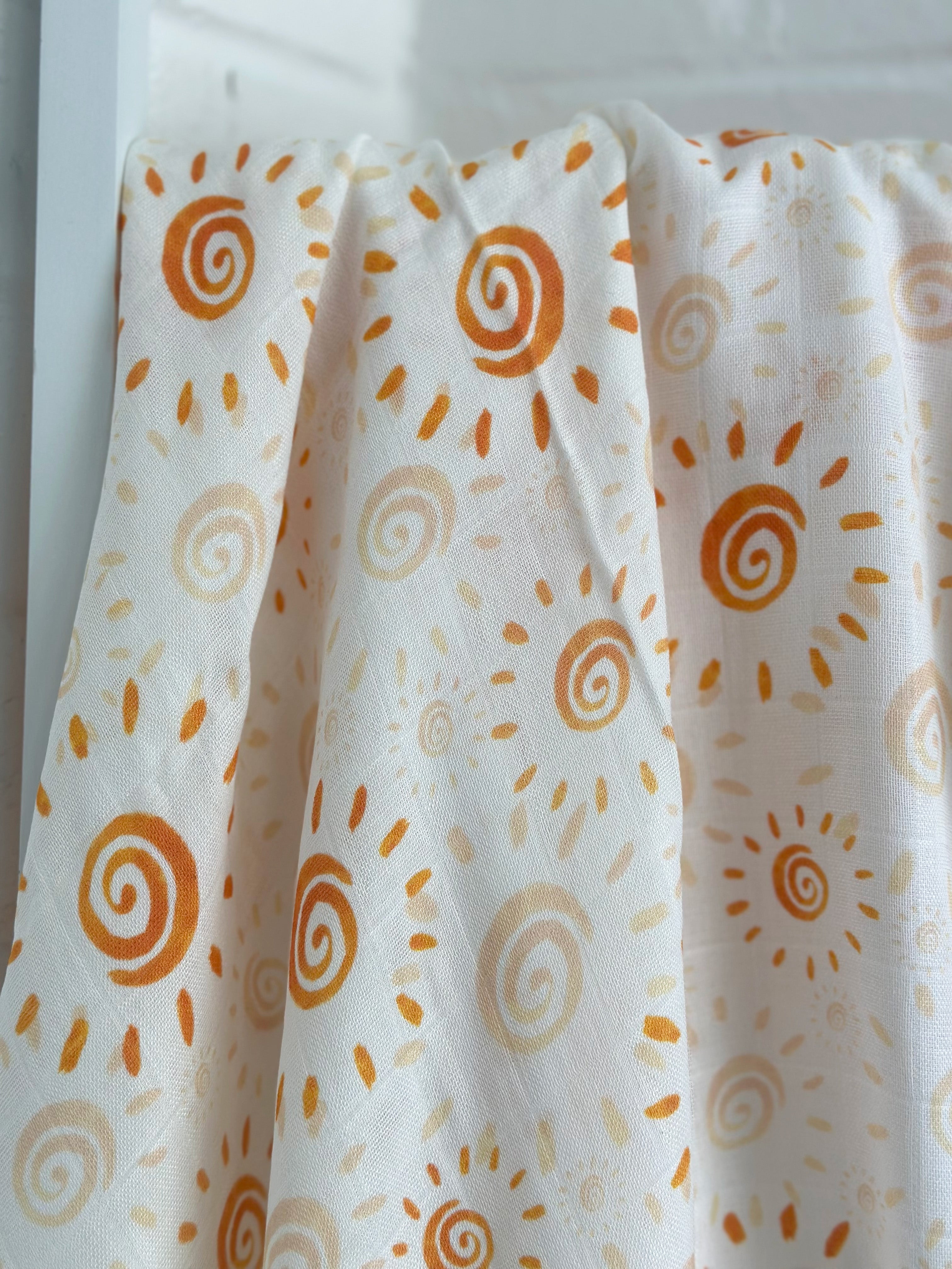 Watercolor Sun Muslin Swaddle