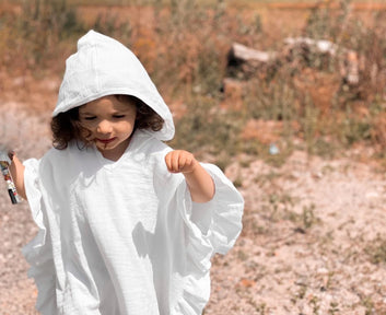 White Muslin Poncho With Ruffles